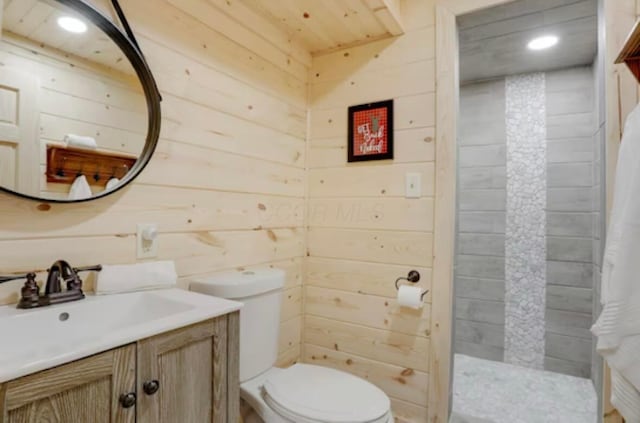 820 Pump Station Rd SE, Sugar Grove, OH 43155 - full bathroom with toilet, vanity, wood walls, tiled shower, and recessed lighting