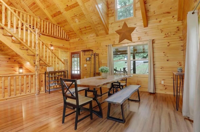 820 Pump Station Rd SE, Sugar Grove, OH 43155 - dining area featuring wood ceiling, light wood-type flooring, beam ceiling, wood walls, and high vaulted ceiling