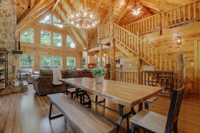 820 Pump Station Rd SE, Sugar Grove, OH 43155 - dining room with high vaulted ceiling, wood-type flooring, a chandelier, beamed ceiling, and stairway