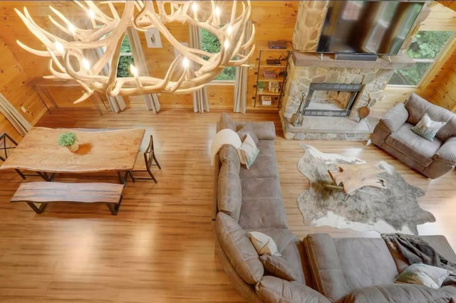 820 Pump Station Rd SE, Sugar Grove, OH 43155 - living area with wood finished floors, a fireplace, and wooden walls