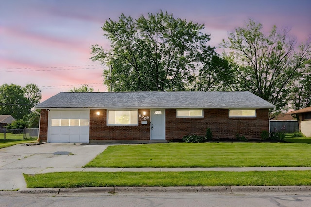 6729 Retton Rd, Reynoldsburg, OH 43068 - ranch-style home featuring a garage, driveway, and brick siding