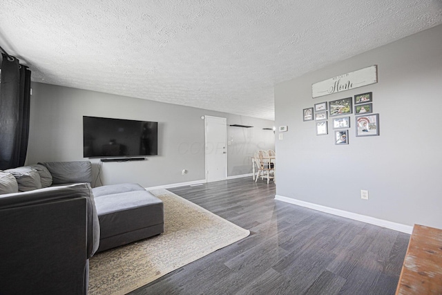 6729 Retton Rd, Reynoldsburg, OH 43068 - living area featuring wood finished floors, a textured ceiling, and baseboards
