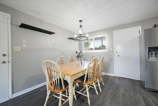 6729 Retton Rd, Reynoldsburg, OH 43068 - dining space with wood finished floors, a chandelier, baseboards, and a textured ceiling