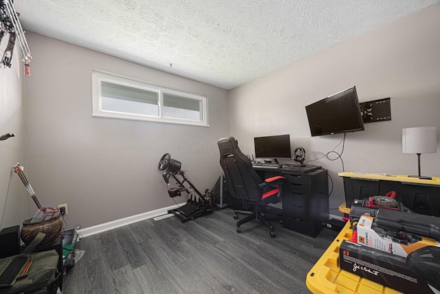 6729 Retton Rd, Reynoldsburg, OH 43068 - home office with dark wood-style floors, a textured ceiling, and baseboards