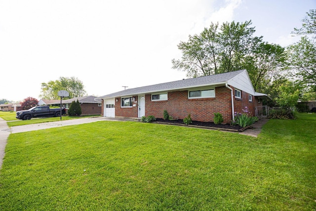 6729 Retton Rd, Reynoldsburg, OH 43068 - single story home with concrete driveway, an attached garage, brick siding, and a front yard