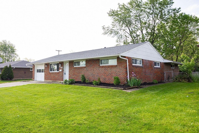 6729 Retton Rd, Reynoldsburg, OH 43068 - single story home featuring a garage, driveway, and brick siding
