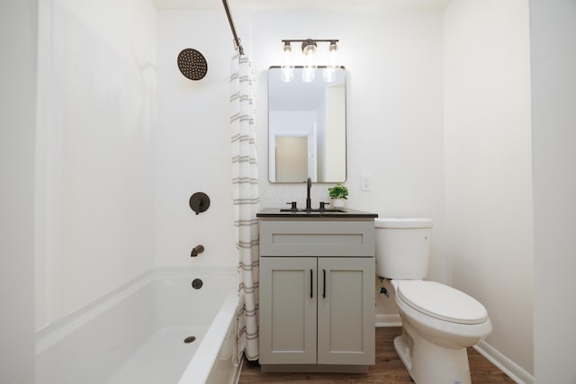 1876 Valcon Ave, Columbus, OH 43207 - bathroom featuring wood finished floors, toilet, shower / bath combo, and vanity