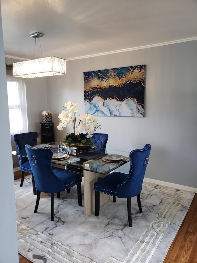 5060 Brinwood Pl, Columbus, OH 43232 - dining room featuring crown molding, wood finished floors, and baseboards