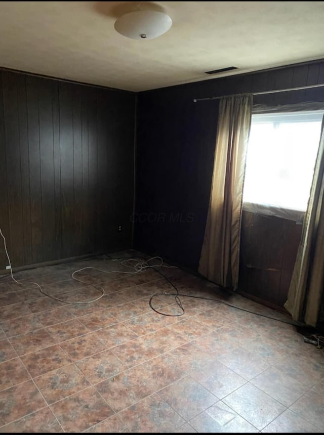 5060 Brinwood Pl, Columbus, OH 43232 - empty room with wood walls