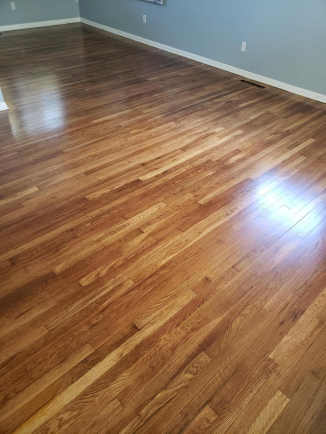5060 Brinwood Pl, Columbus, OH 43232 - empty room with dark wood finished floors and baseboards