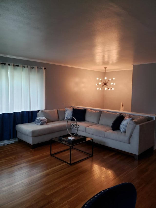 5060 Brinwood Pl, Columbus, OH 43232 - living room with wood finished floors, a chandelier, and ornamental molding
