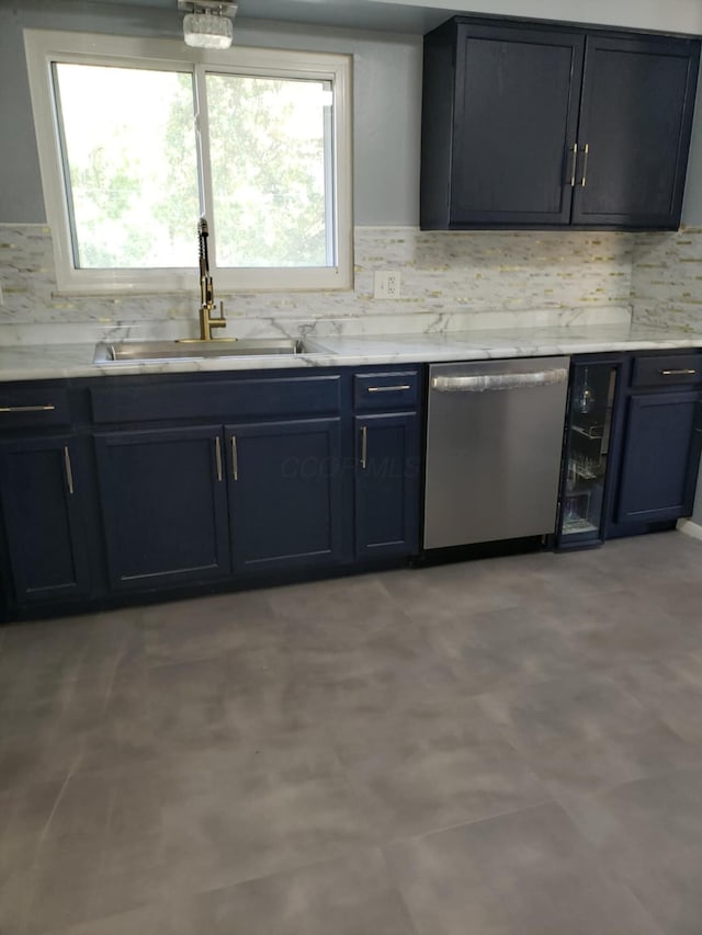 5060 Brinwood Pl, Columbus, OH 43232 - kitchen featuring stainless steel dishwasher, a sink, healthy amount of natural light, and tasteful backsplash