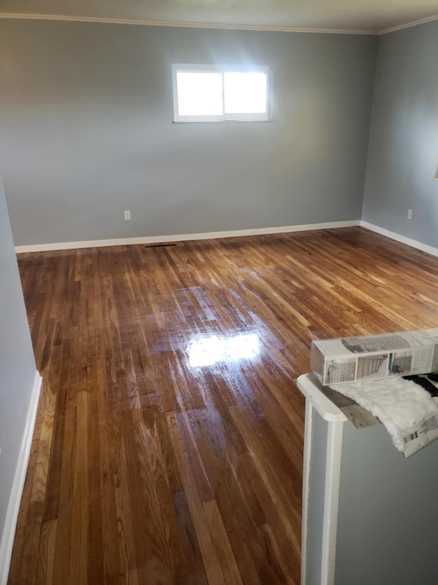 5060 Brinwood Pl, Columbus, OH 43232 - spare room with ornamental molding, dark wood-type flooring, and baseboards