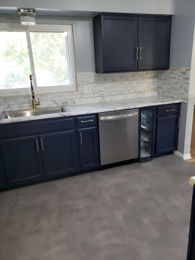 5060 Brinwood Pl, Columbus, OH 43232 - kitchen featuring stainless steel dishwasher, a sink, backsplash, beverage cooler, and blue cabinetry