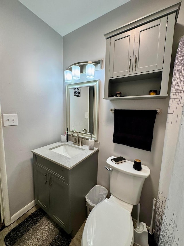 965 Bikini Dr, Marion, OH 43302 - bathroom featuring toilet, baseboards, and vanity