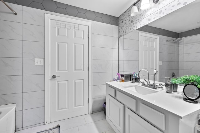 bathroom featuring tile walls, vanity, a bathtub, a shower, and marble finish flooring