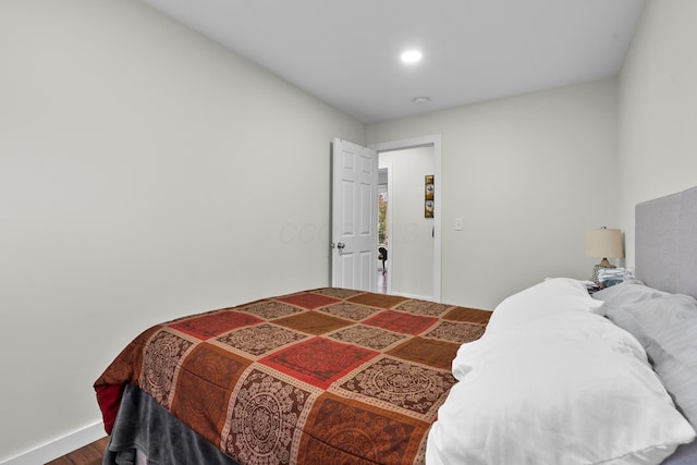 bedroom with wood finished floors