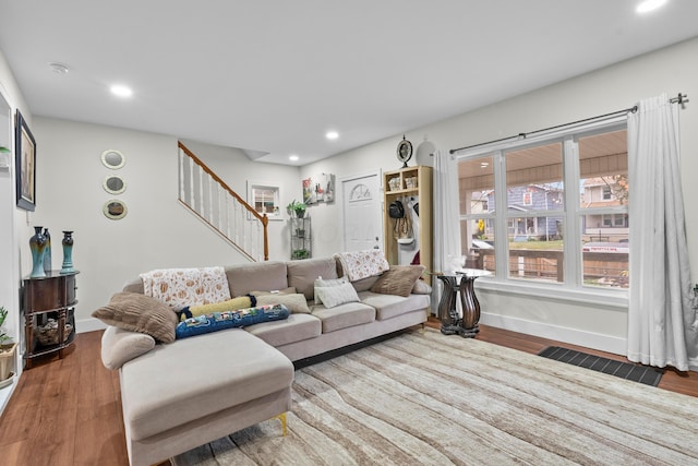 living area featuring stairs, wood finished floors, recessed lighting, and baseboards