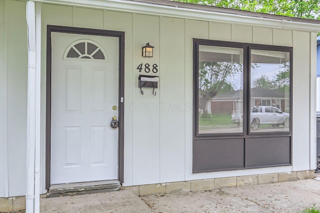 property entrance with board and batten siding