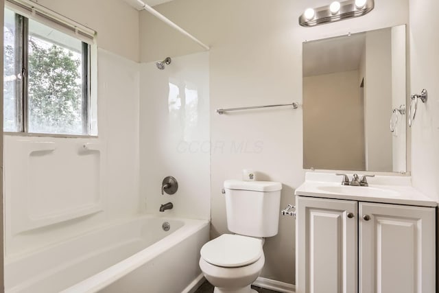 bathroom with toilet, shower / bathtub combination, and vanity
