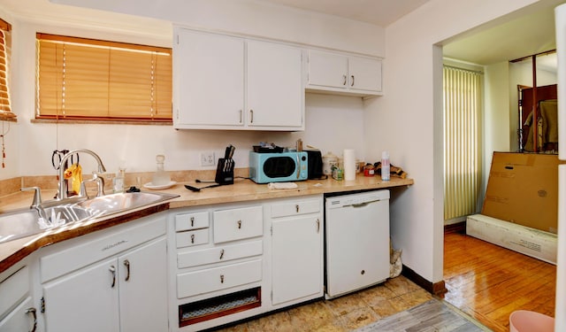 1934 Stratford Way, Columbus, OH 43219 - kitchen with dishwasher, a sink, white cabinetry, and light countertops
