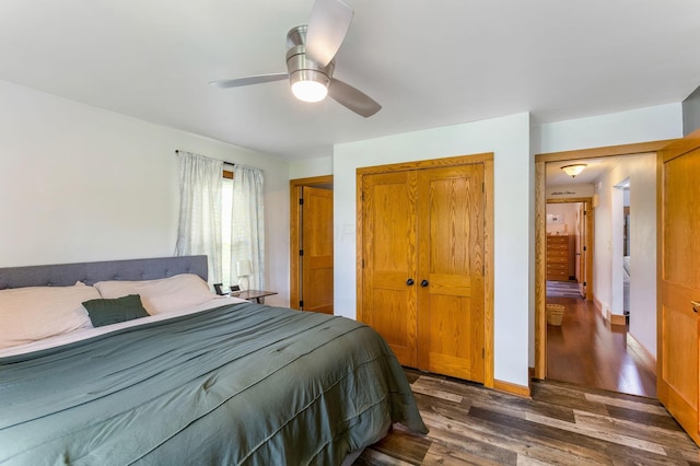 200 Park Ave, New Lexington, OH 43764 - bedroom with a closet, dark wood-style floors, ceiling fan, and baseboards