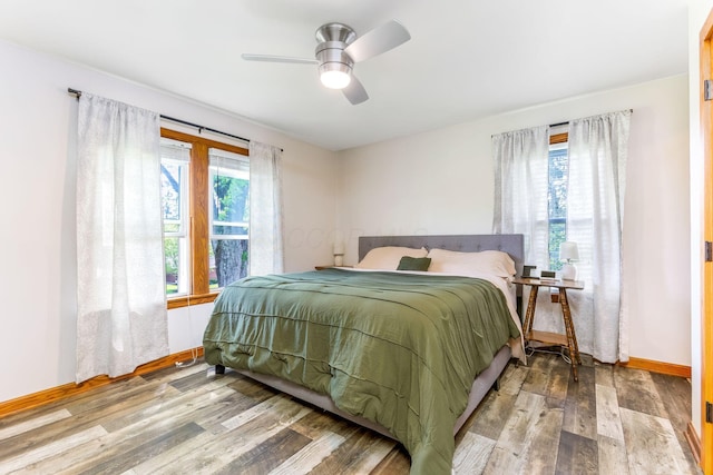 200 Park Ave, New Lexington, OH 43764 - bedroom with wood finished floors, baseboards, and ceiling fan