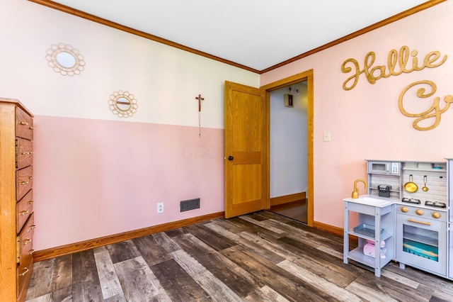 200 Park Ave, New Lexington, OH 43764 - rec room with baseboards, dark wood finished floors, and crown molding