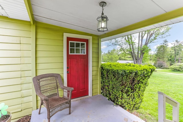200 Park Ave, New Lexington, OH 43764 - view of exterior entry with a lawn and a porch