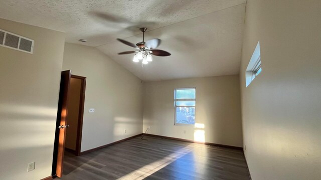 7586 Jenkins Dr, Canal Winchester, OH 43110 - unfurnished room featuring wood finished floors, ceiling fan, vaulted ceiling, baseboards, and a textured ceiling
