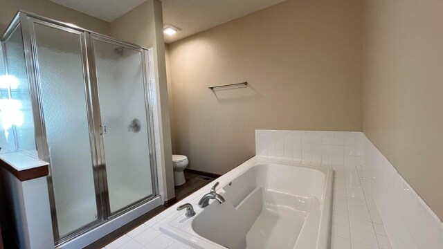 7586 Jenkins Dr, Canal Winchester, OH 43110 - bathroom featuring toilet, a stall shower, a bath, and tile patterned flooring