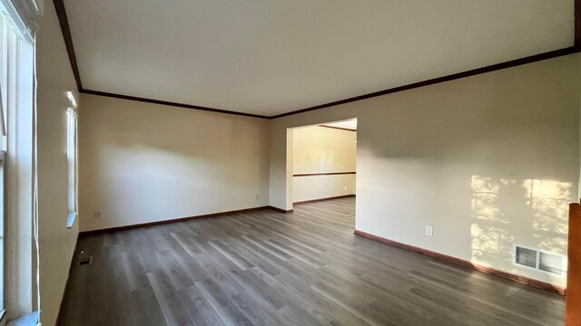 7586 Jenkins Dr, Canal Winchester, OH 43110 - empty room with crown molding, wood finished floors, and baseboards