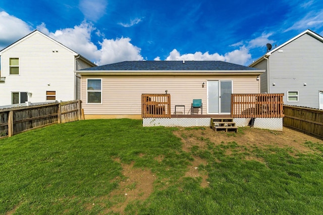 rear view of property with a deck and a shingled roof