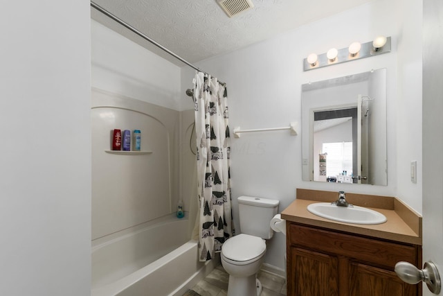bathroom featuring toilet, shower / tub combo, vanity, and a textured ceiling