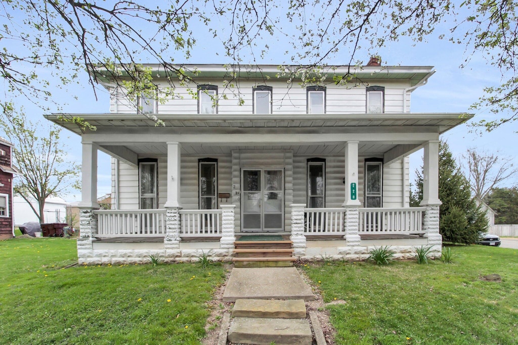 220 E Market St, Baltimore, OH 43105 - view of front of property with a porch, a front yard, and a chimney