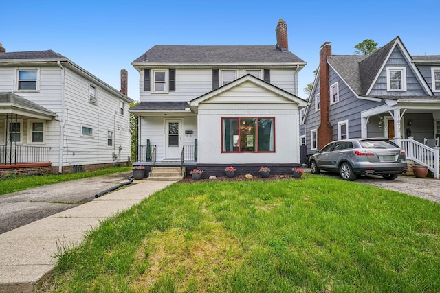 1066 Kelton Ave, Columbus, OH 43206 - view of front facade with a front lawn and a chimney