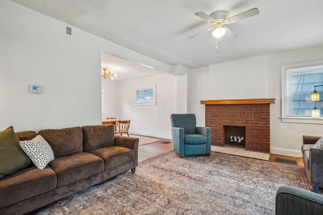1066 Kelton Ave, Columbus, OH 43206 - living area with a ceiling fan, wood finished floors, baseboards, and a fireplace