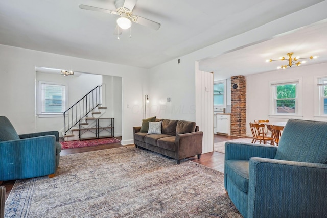 1066 Kelton Ave, Columbus, OH 43206 - living area with a chandelier, wood finished floors, stairs, and a ceiling fan