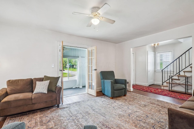 1066 Kelton Ave, Columbus, OH 43206 - living area with wood finished floors, healthy amount of natural light, stairs, and ceiling fan