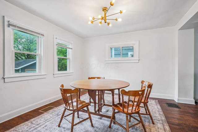 1066 Kelton Ave, Columbus, OH 43206 - dining area with a chandelier, baseboards, and wood finished floors