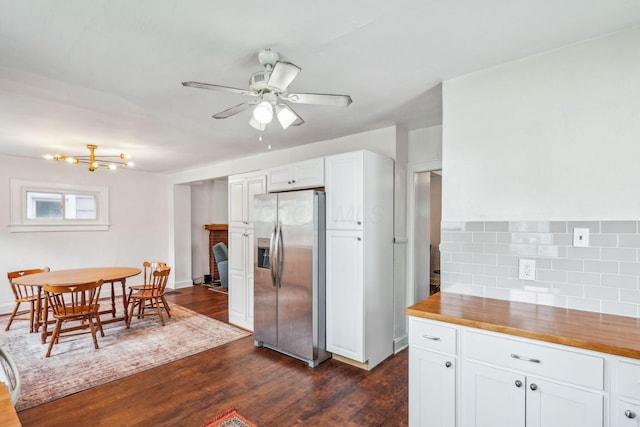 1066 Kelton Ave, Columbus, OH 43206 - kitchen with stainless steel refrigerator with ice dispenser, wood counters, dark wood-style floors, and white cabinets