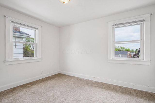 1066 Kelton Ave, Columbus, OH 43206 - spare room featuring carpet flooring and baseboards