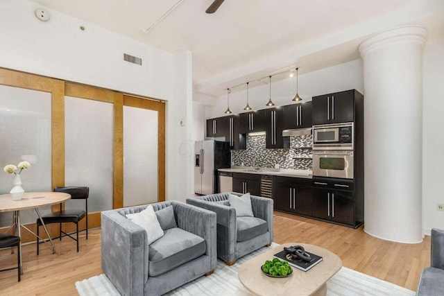 106 N High St Unit 504, Columbus, OH 43215 - living area featuring light wood-style floors