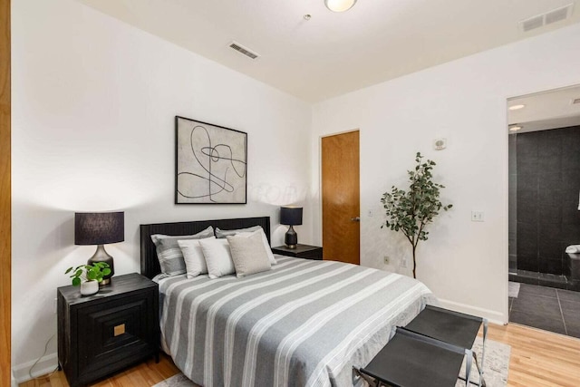 106 N High St Unit 504, Columbus, OH 43215 - bedroom with light wood finished floors and baseboards