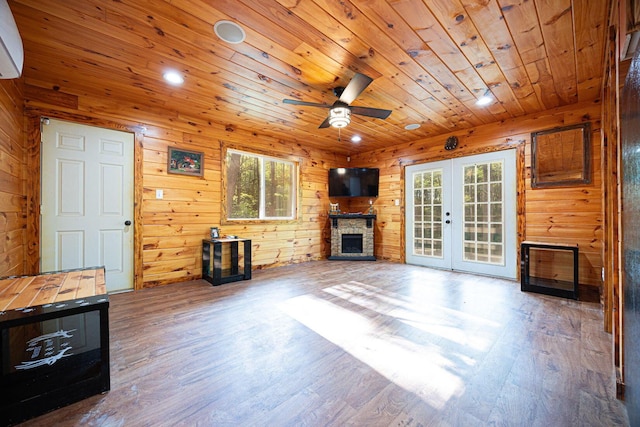 34047 W Buckingham Rd, Logan, OH 43138 - unfurnished living room featuring wood ceiling, french doors, ceiling fan, a fireplace, and wood finished floors