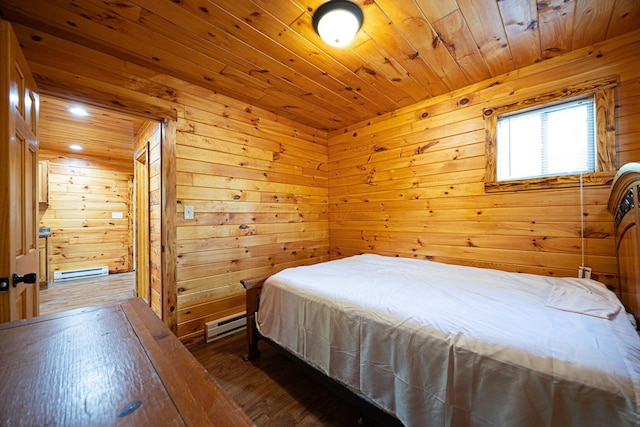 34047 W Buckingham Rd, Logan, OH 43138 - bedroom with wooden walls, wooden ceiling, hardwood / wood-style floors, and a baseboard heating unit