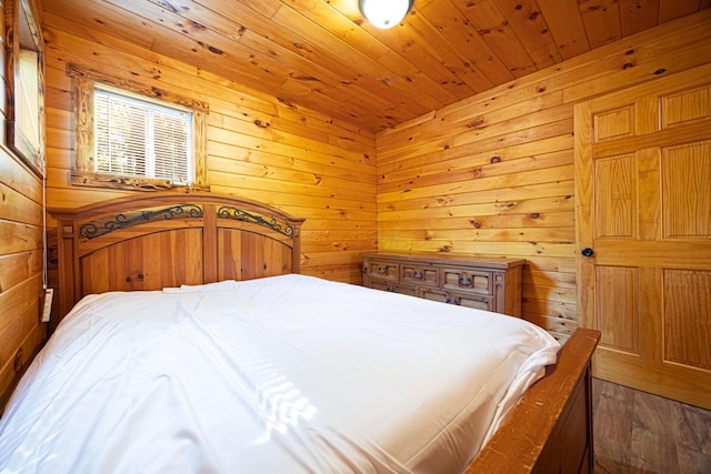 34047 W Buckingham Rd, Logan, OH 43138 - bedroom with wooden walls, wooden ceiling, and wood finished floors