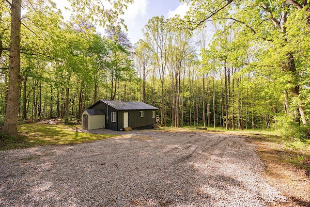 34047 W Buckingham Rd, Logan, OH 43138 - view of outdoor structure with an outdoor structure and a wooded view