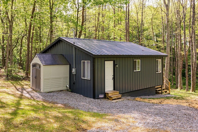 34047 W Buckingham Rd, Logan, OH 43138 - garage featuring a forest view