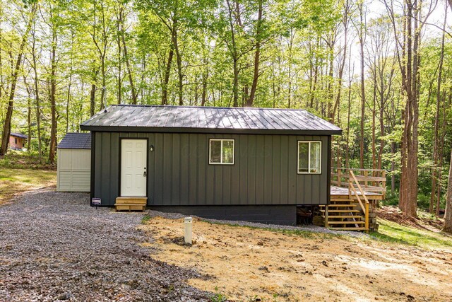 34047 W Buckingham Rd, Logan, OH 43138 - view of outbuilding with an outdoor structure and a wooded view
